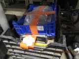 a blue crate with a orange ribbon sitting on a pallet