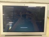 someone taking a picture of a laptop screen with a cell phone