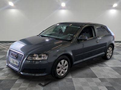 a picture of a gray car parked in a garage