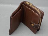 leather wallet with a zippered closure on the inside of it