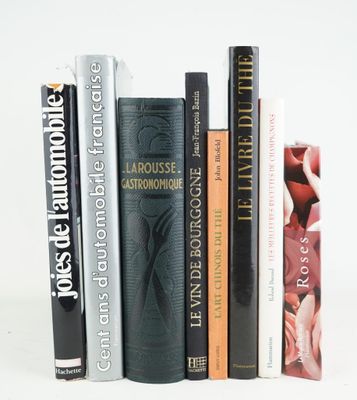 many books that are lined up on a white table