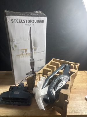 a box of tools on a table next to a box of scissors