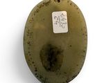 an oval shaped object with a sticker on it ' s side