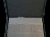 a open suitcase with a lot of papers inside of it