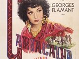 une vieille affiche de cinéma représentant une femme en robe rouge et portant des boucles d'oreilles dorées