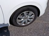 a white car that is parked in the parking lot