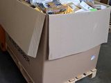 a large cardboard box on a pallet in a warehouse