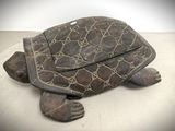 an image of a wooden turtle sitting on top of a white surface