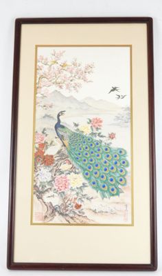 framed picture of a peacock sitting on a branch of a tree