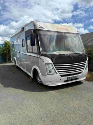 an image of a motor home parked in a parking lot