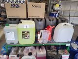 many containers and containers on a shelf in a garage