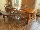 a table and chairs in a room with a tile floor