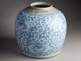 a blue and white vase sitting on a table