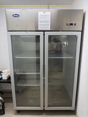 two glass doors that are open in a kitchen