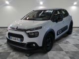 the white citrole is parked on a checkered floor