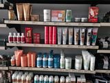 many different types of hair products on the shelves