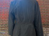 the back of a woman ' s jacket on a mannequin mannequin mannequin mannequin mannequin mannequin mannequin mann