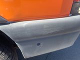 a close up of a truck with a flat tire