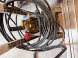 a picture of a water pump and hoses in a garage
