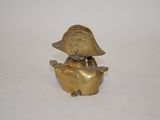 brass figurine of a duck wearing a hat and a bow