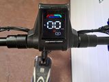 a close up of a bike with a digital display on the handlebar
