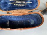 a pair of shoes in a case on a table