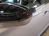 a picture of a car with a sticker on it ' s side mirror