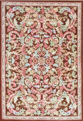un tapis marron et rose orné d'un motif floral