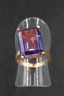 an image of a ring with an amethorate stone in it