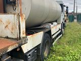 a truck that has a large tank on the back of it