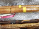 a pile of bamboo sticks and other items on a table