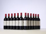 six bottles of red wine lined up in a row