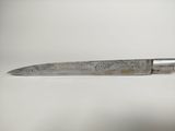 a knife that is sitting on a table