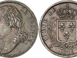 a silver coin with a crown on the front and a crown on the back
