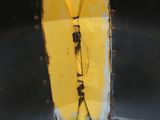 a yellow plow sitting in the middle of a field