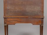 an old wooden desk with a marble top and legs