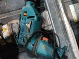 a drill that is laying on the floor next to a box