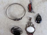 a lot of jewelry that is laying on the floor