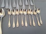 a lot of silver spoons and spoon spoons on a table