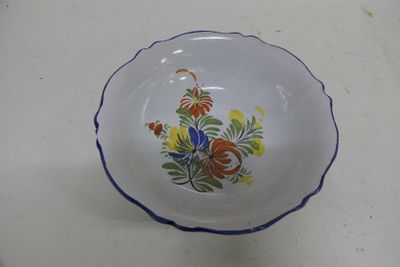 a small bowl with a flower design on it