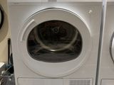 two washers and a dryer stacked on top of each other