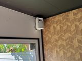 a picture of a window with a small air conditioner attached to it