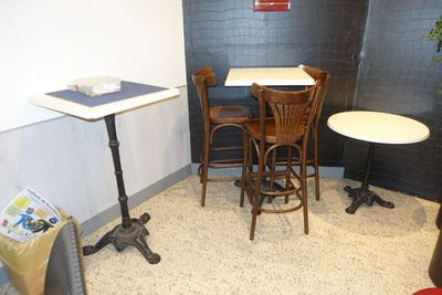 a small table and chairs in a small room