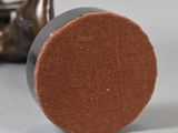 an image of a close up of a metal object on a table