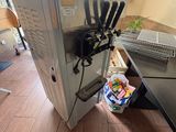 a machine that is sitting on the floor next to a table