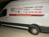 a van that is parked in a garage with the door open
