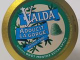 a close up of a tin of alodut la george gum