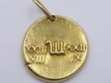 an image of a gold coin with the word love written on it