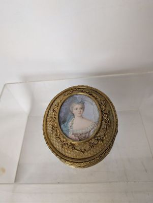 a glass box with a picture of a woman on it