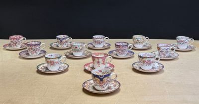 a lot of cups and saucers on the table
